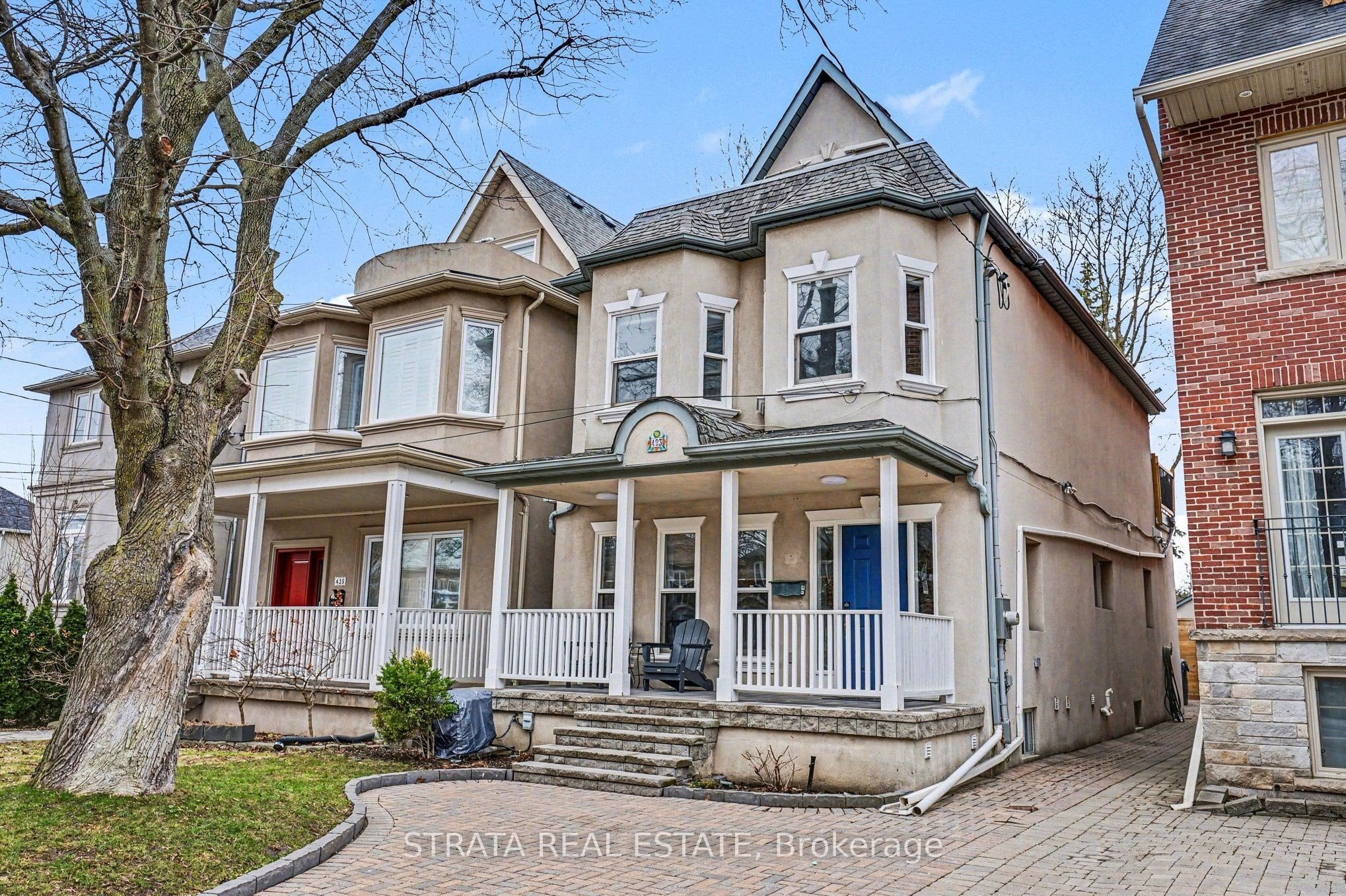 Front exterior of 423 Manor Road E, a 2.5-storey detached home in Leaside, Toronto
