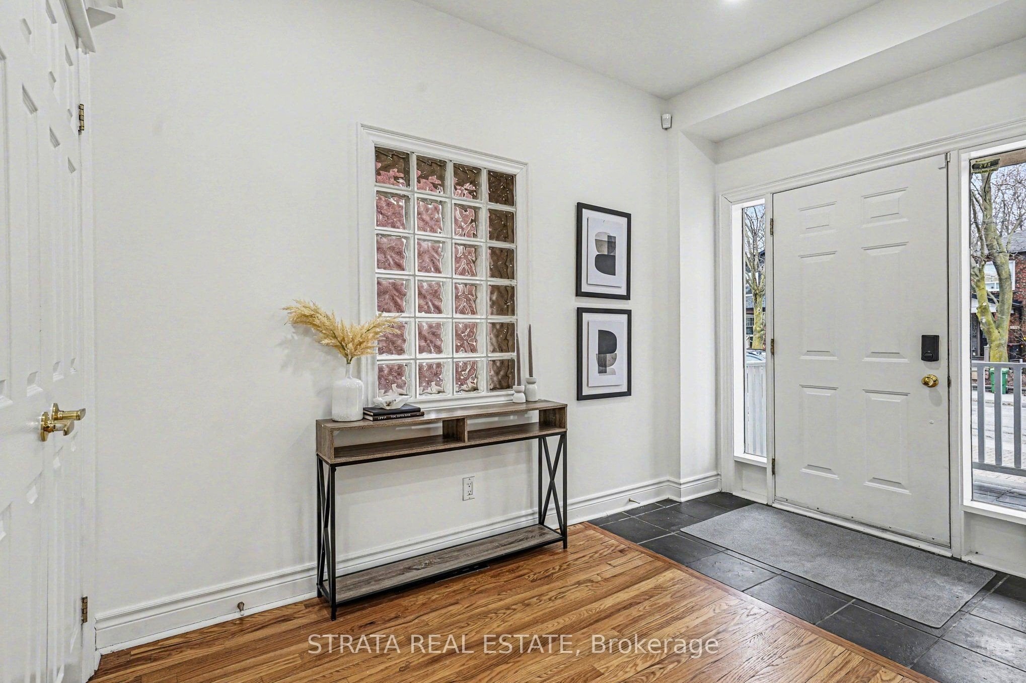 Front entry and foyer with hardwood floors