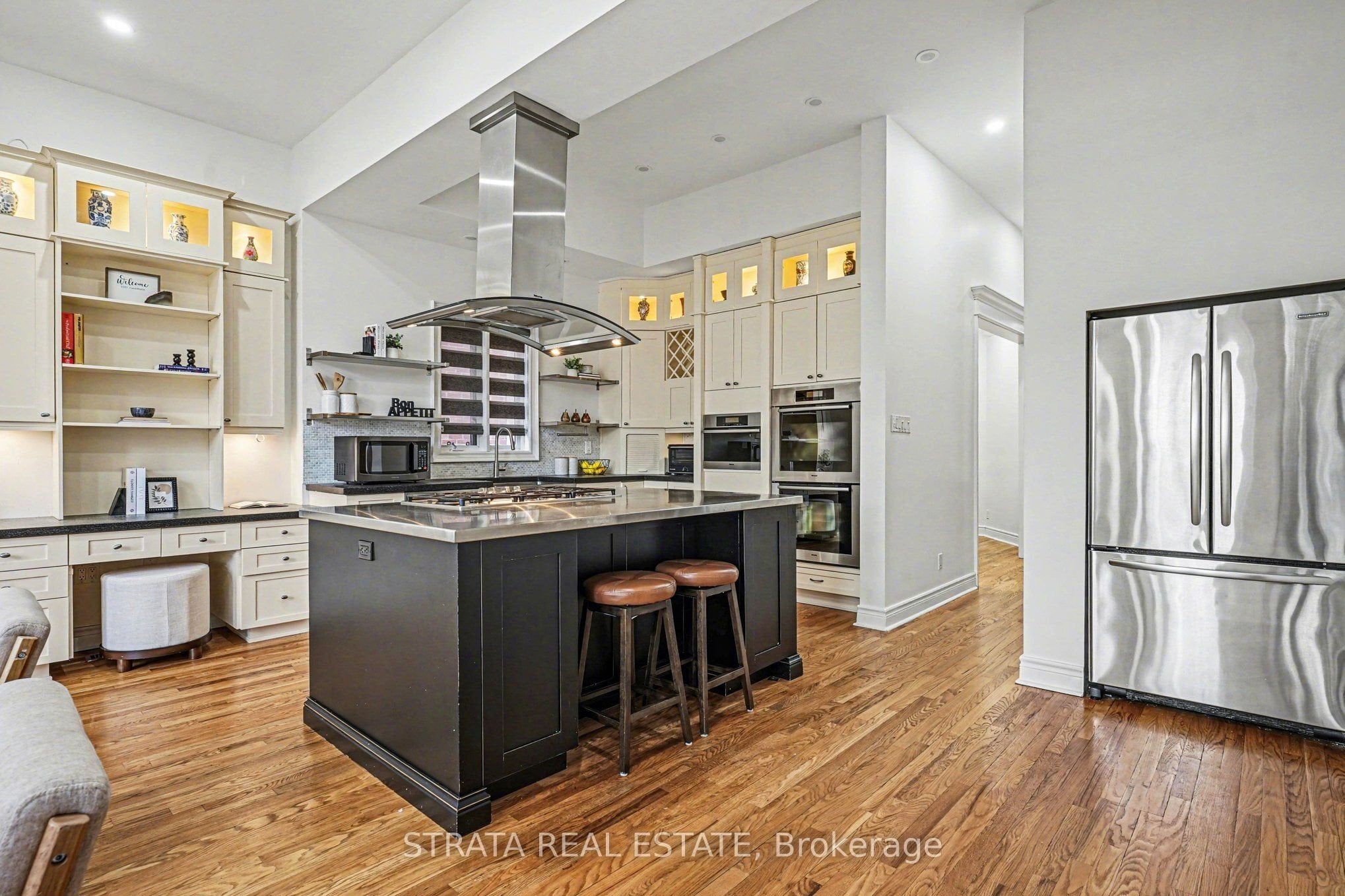 Open-concept living area with oversized windows